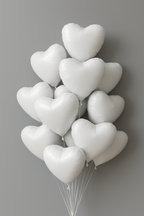 Bunch of white heart-shaped balloons against a gray background
