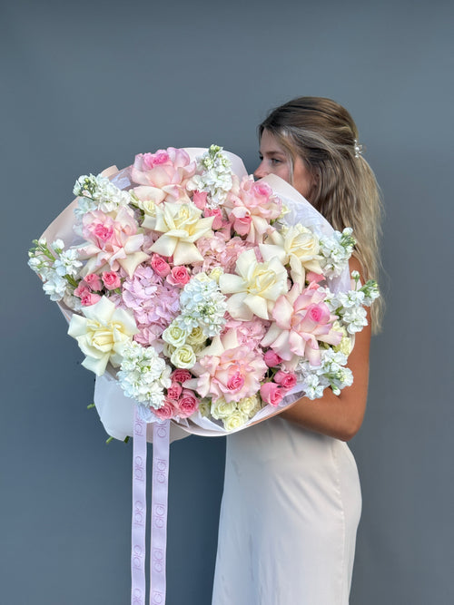 Luxury bouquet featuring premium blush roses, hydrangeas, and seasonal blooms by GiGi Flower Studio