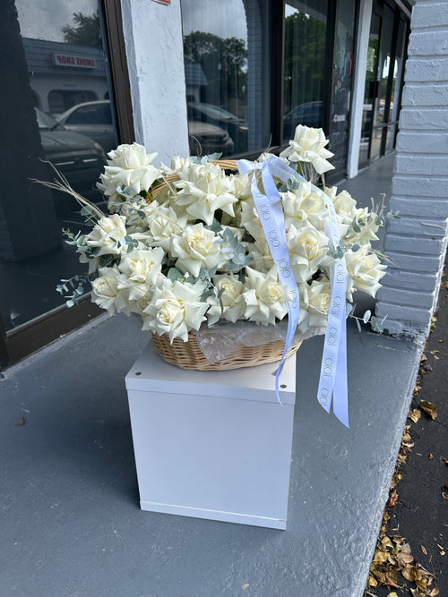 basket full of white flowers