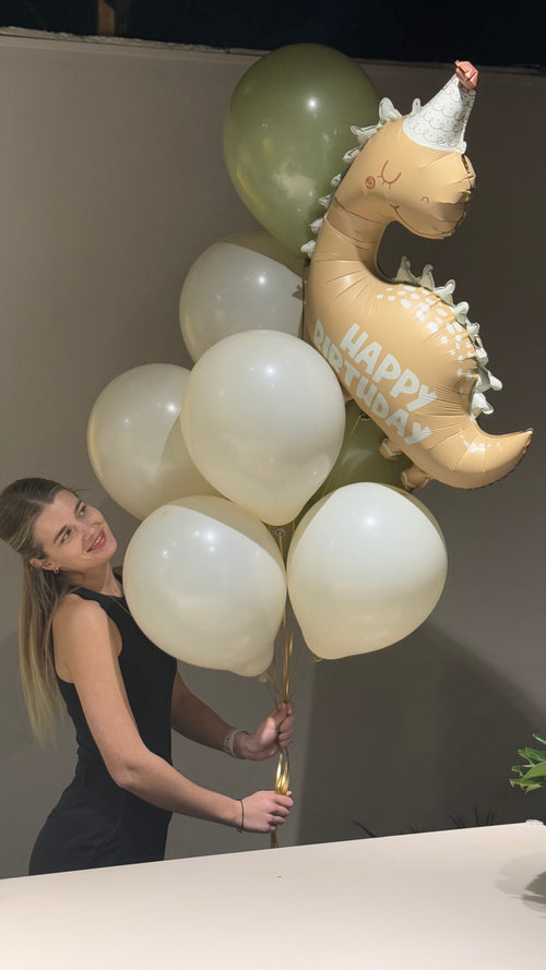 White, peach and green colored balloons