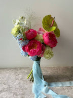 Bunch of red, blue, yellow and white flowers