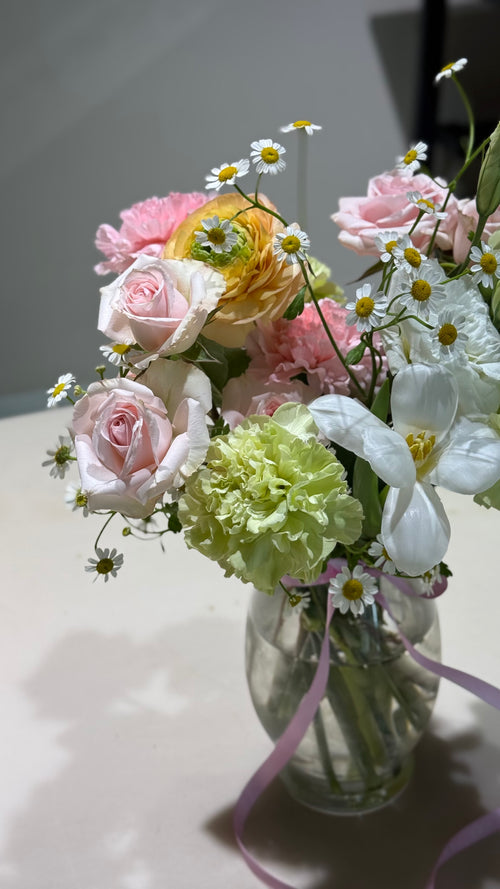 Colorful flowers in a jar