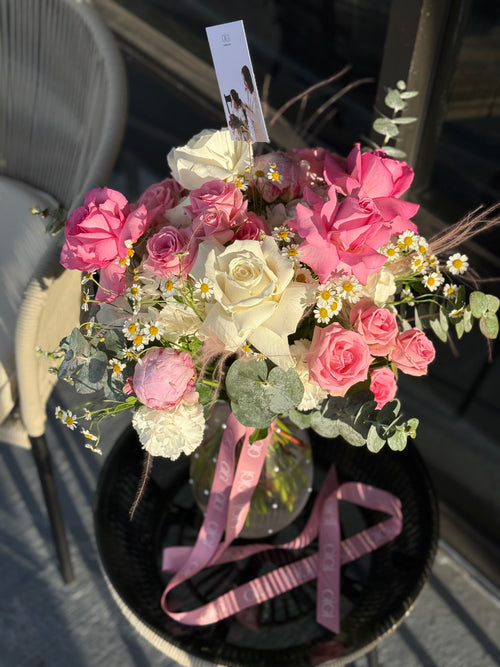 Pink and Creme flowers in a pot