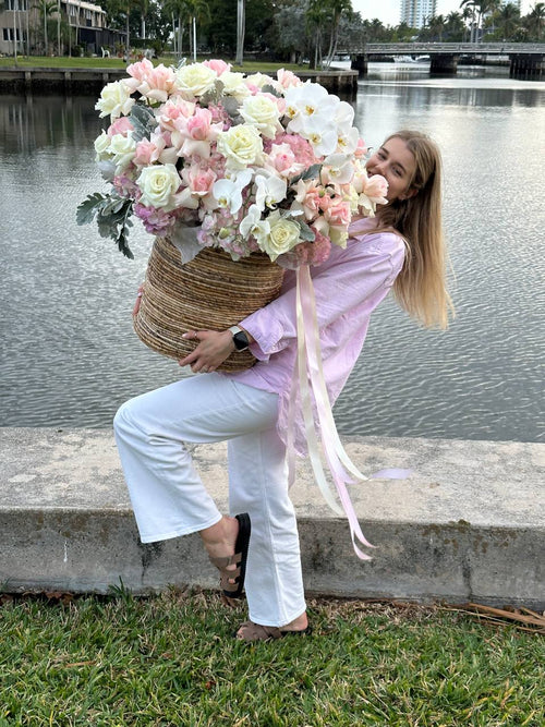 Huge basket full of white and pink flowers