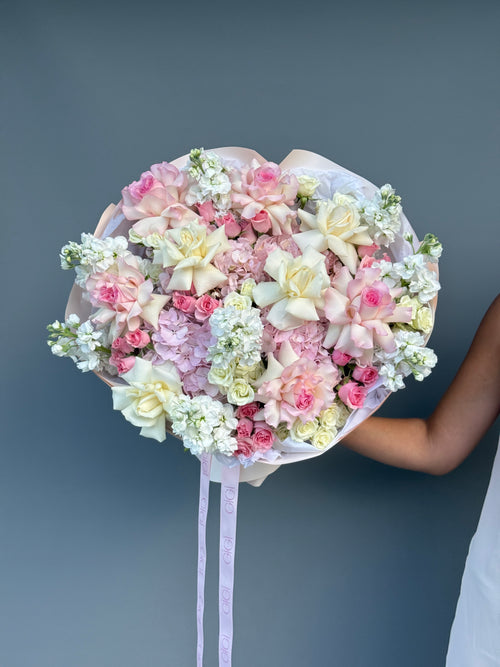 Handcrafted premium rose bouquet in blush and ivory tones