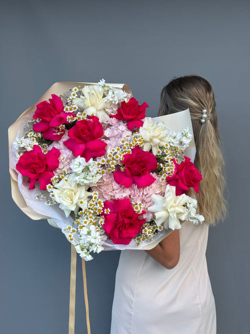 Luxury bouquet with hot pink roses, white garden roses and pink hydrangeas by GiGi Flower Studio