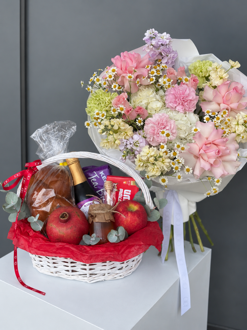 Sweet Beginnings Rosh Hashanah flower bouquet and gift basket with challah, apples, pomegranate, honey and kosher treats