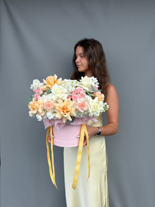 Handcrafted luxury flower box featuring roses, hydrangeas, and seasonal blooms