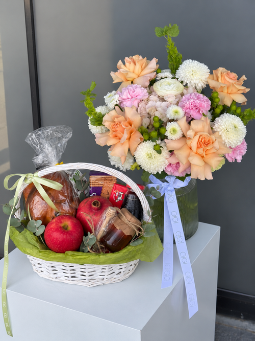 New Year in Bloom Rosh Hashanah floral arrangement and gift basket with challah, apple, pomegranate, honey and kosher treats