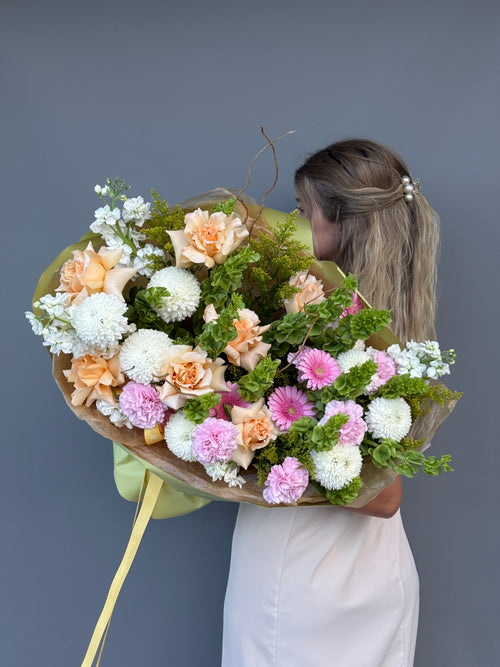 WOW Garden  premium bouquet with peach roses, Bells of Ireland, and white chrysanthemums by GiGi Flower Studio