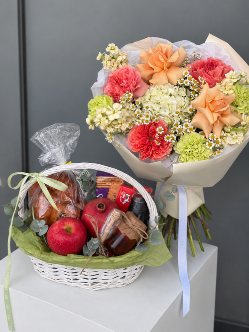 Shana Tova Celebration Rosh Hashanah flower bouquet and gift basket with challah, apple, pomegranate, honey and kosher treats